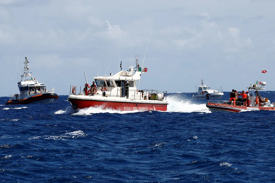 Rescue personnel in the area where the luxury yacht Bayesian sank, off the coast of Sicily.