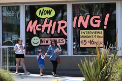 A McDonald's restaurant in Garden Grove, California, making its hiring spree known in April. The US labour market  remains tight. There were 1.7 job openings for every unemployed person on Aug 31. Layoffs remain low.