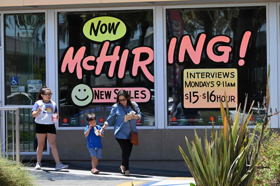 A McDonald's restaurant in Garden Grove, California, making its hiring spree known in April. The US labour market  remains tight. There were 1.7 job openings for every unemployed person on Aug 31. Layoffs remain low.