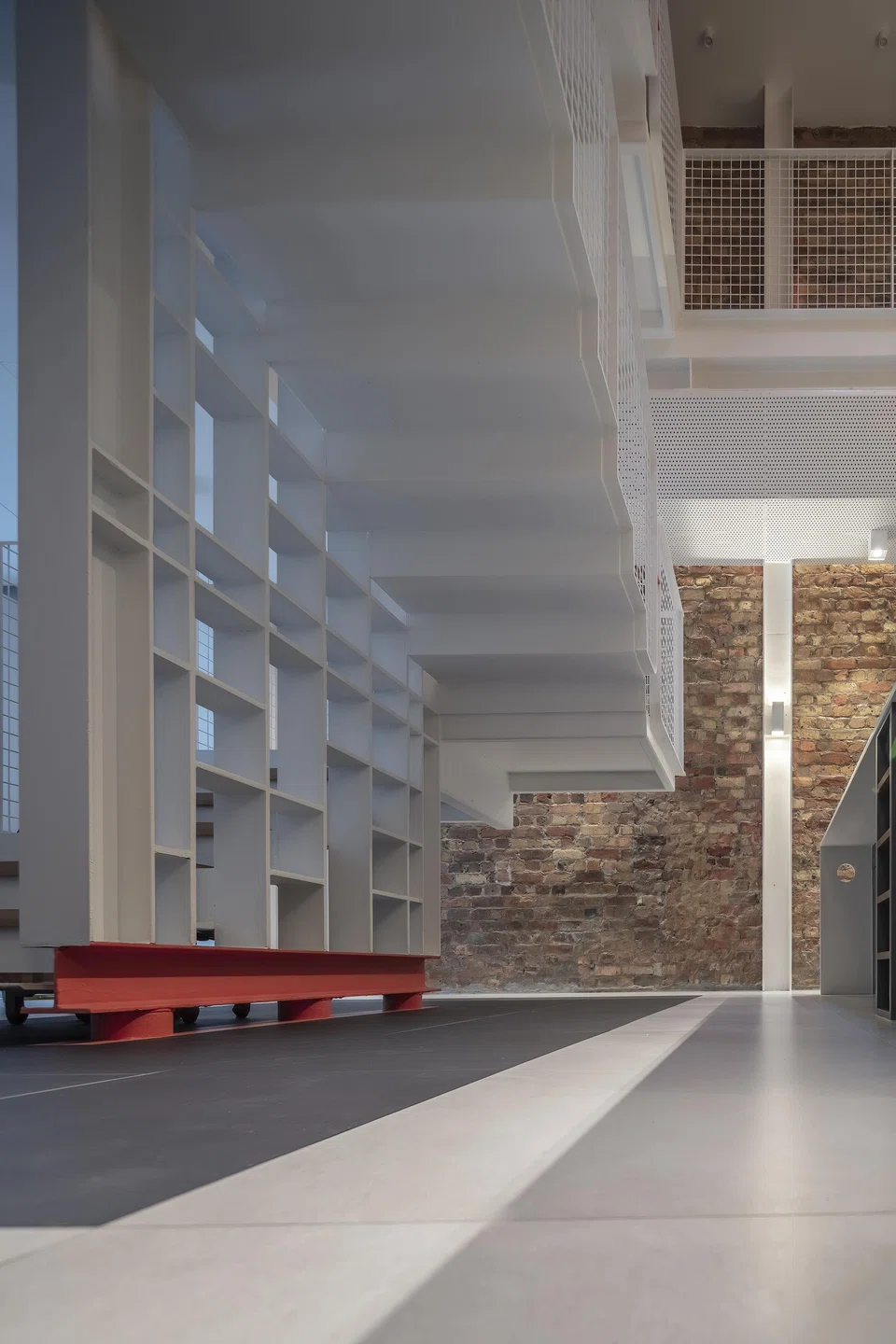 The new staircase base stands out for its bright vermilion shade.