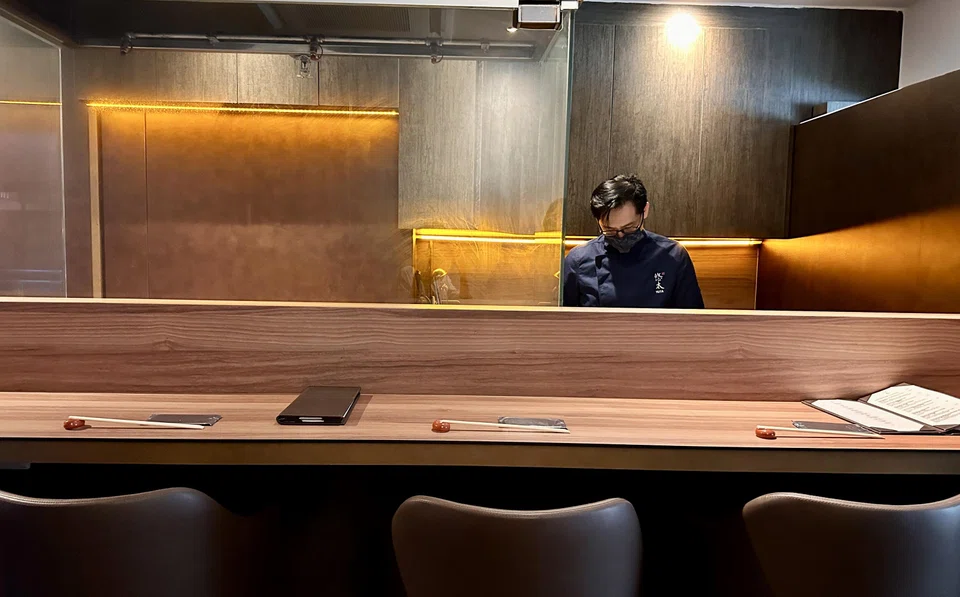 The interior is a tight fit, squeezing in an 8-seat counter and private room.