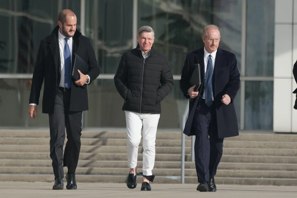 Matthew Smith (centre), the partner of former Abercrombie & Fitch CEO Mike Jeffries, exits after being arraigned in federal court, Central Islip, New York, Dec 3, 2024. Jeffries and Smith have been arrested and charged with running a prostitution and international sex trafficking operation. 