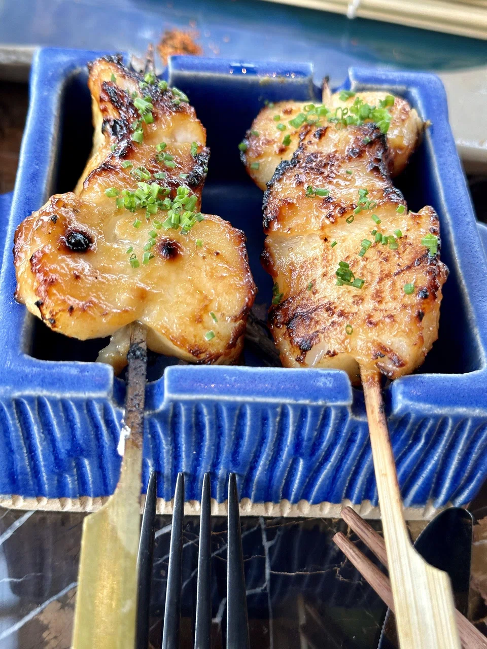 Grilled Chilean sea bass anticuchos (skewers).
