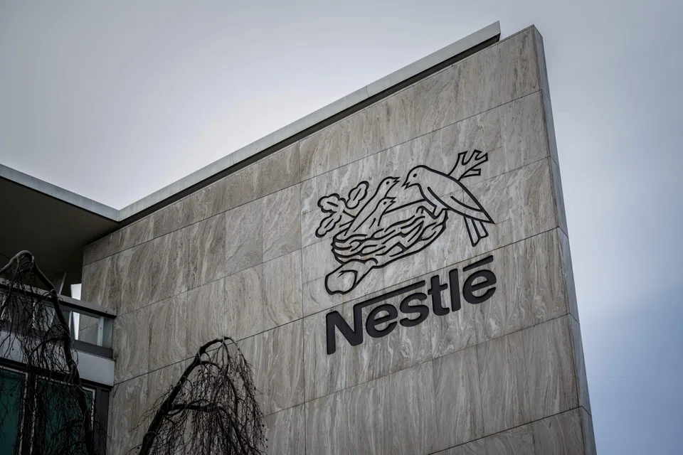 Nestle, the world’s biggest packaged food company, lowered its organic sales outlook to at least 3 per cent from about 4 per cent previously.
