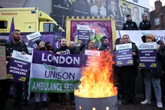 Ambulance workers take part in a strike over pay outside NHS London Ambulance Service in London last month.