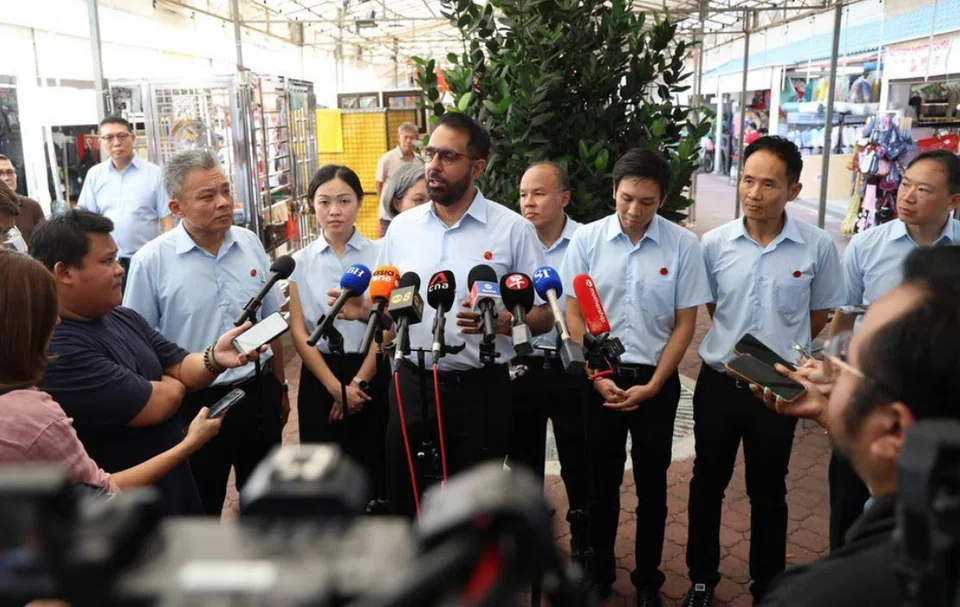 Workers' Party chief Pritam Singh (centre) speaking to the media during a doorstop in Tampines on April 28.