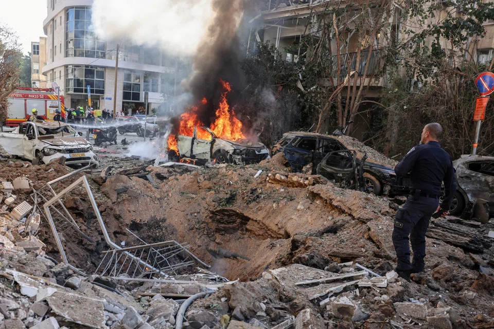Emergency personnel at a site following Iranian missile barrages in Tel Aviv on Mar 24. Israeli officials think it highly unlikely Iran would agree to US demands in any new round of negotiations.