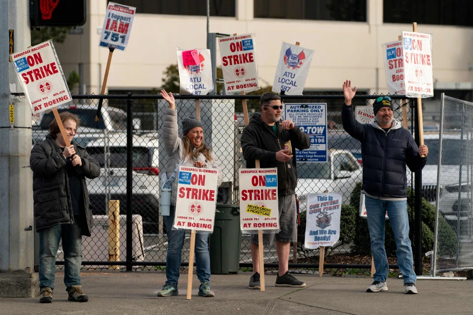 Boeing workers on strike gather near the entrance to a Boeing facility in Seattle, Washington, Oct 24, 2024.