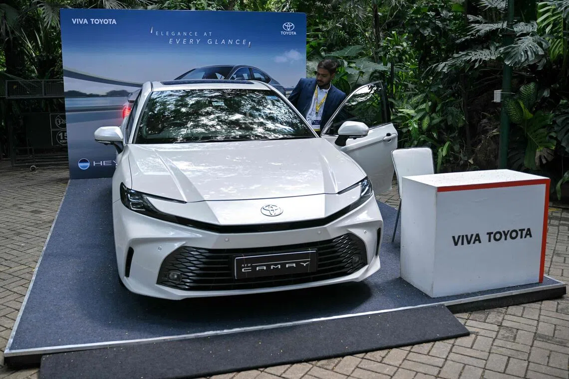 A Toyota Camry car is displayed at the India Innovation Summit – Innoverge 2025 in Bengaluru, India, Oct 10, 2025. Toyota is aiming to lift its share of the country’s passenger car market before the end of the decade to 10 per cent from 8 per cent currently, a sources said.