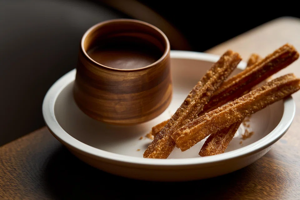 Churros in chocolate sauce.
