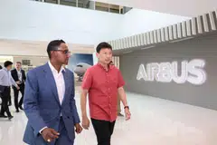 Anand Stanley (left), president and head of region, Airbus Asia-Pacific; and Minister for Transport Chee Hong Tat touring the Airbus Asia Training Centre on May 7, 2025. 