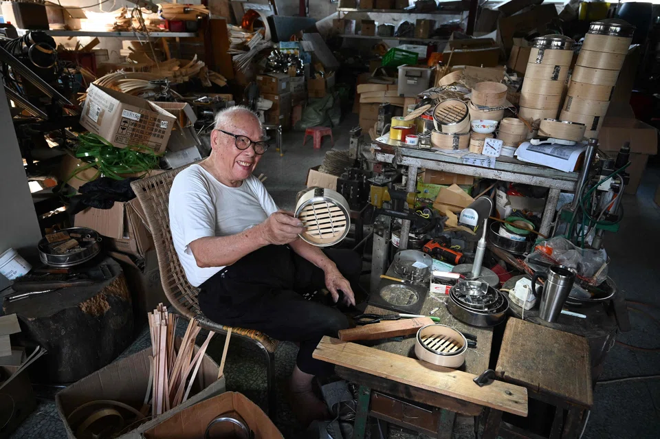 Lui Ming with a bamboo steamer, a utensil essential to Cantonese cooking. Steamers like his are an indispensable part of yum cha, the Cantonese brunch involving tea and dim sum – perhaps the most prized culinary ritual in the city.