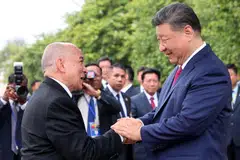 China's President Xi Jinping (right) greeting Cambodia's King Norodom Sihamoni at the Royal Palace in Phnom Penh. Xi reiterated the two countries have an “ironclad friendship”, but also urged Cambodia to crack down on online frauds. 