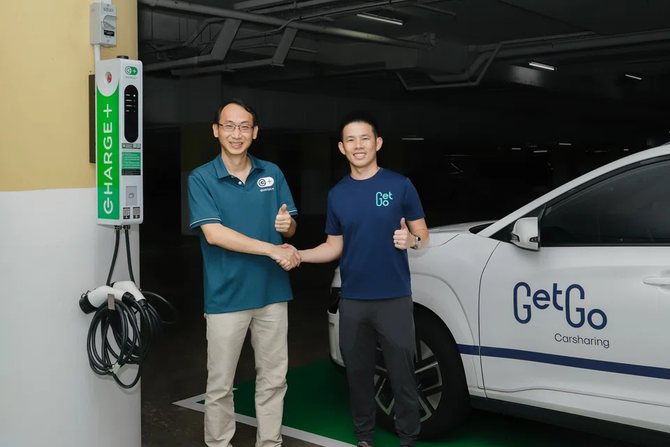 (From left) Goh Chee Kiong, chief executive of Charge+, and Toh Ting Feng, GetGo's chief executive. GetGo and Charge+ said they will continue to expand their car sharing and charging services to more condos across Singapore. 