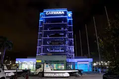 A Carvana used car "vending machine", in Miami, Florida, December 2022. The online used car seller wanted to replace traditional dealers with "technology and exceptional customer service", but has now had two rounds of staff layoffs as sales slowed. 