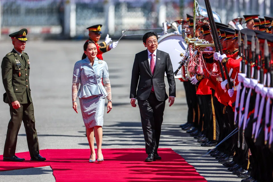 PM Wong reviewing an honour guard with Thai Prime Minister Paetongtarn Shinawatra at the Government House in Bangkok on Thursday morning.