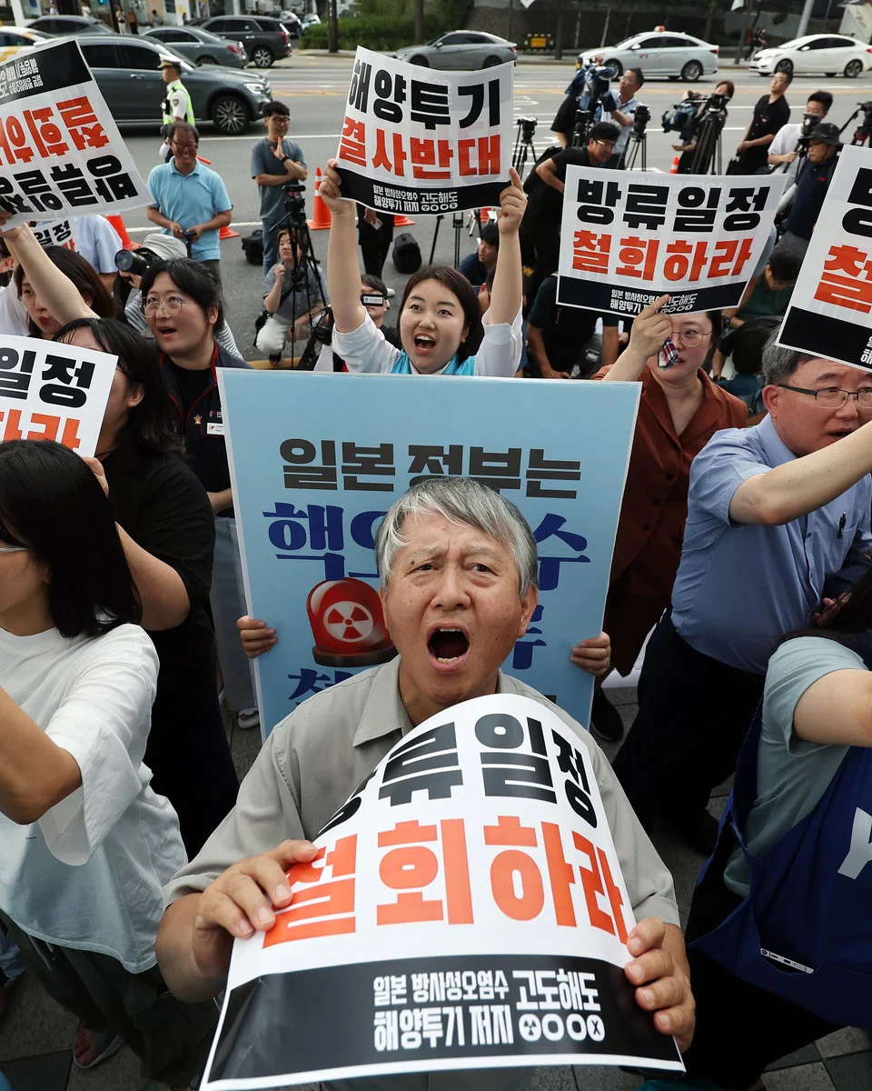 Protestors shout slogans during a rally in front of the Japanese Embassy in Seoul to call on the Japanese government; the government has launched a voucher programme offering up to 20,000 won to shoppers who buy seafood.