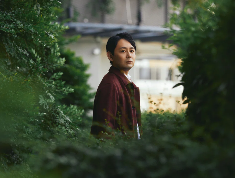Yusuke Shibata wearing red wool jacket by Zegna.