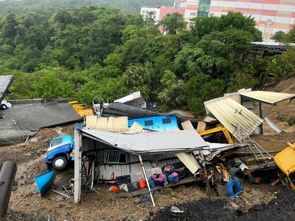 Public utility vehicles trapped in a landslide that was triggered by heavy rainfall after Typhoon Krathon swept across Taiwan near Keelung City's Bureau of Environmental Protection, Oct 4, 2024.