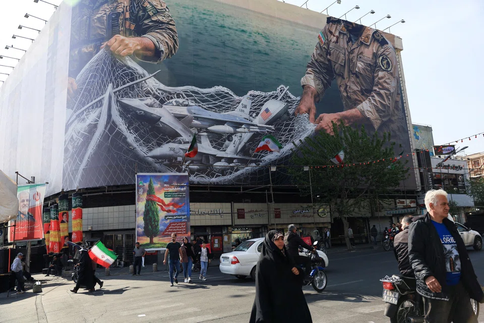 An anti-US billboard on a building in Teheran on Apr 16. The US-Israeli attack on Iran that started on Feb 28 has triggered the worst oil price shock in history.     