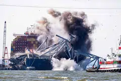 Crews conduct a controlled demolition of a section of the Francis Scott Key Bridge resting on the Dali container ship in Baltimore on May 13, 2024. The Francis Scott Key Bridge collapsed on March 26 when the Dali container ship lost power and collided into a support column, killing six roadway construction workers. 
