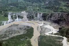An aerial view shows a section of oil palm plantations submerged in water amid deforestation in the mountains of Sumatra, Aceh province.