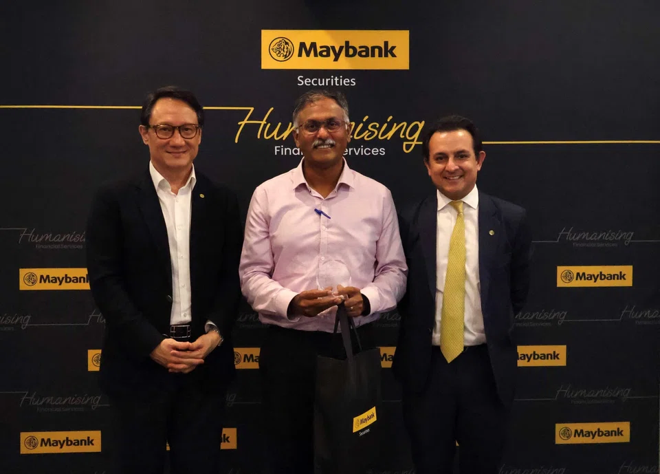 From left: Alvin Lee, country CEO, Maybank Singapore; Murali Pillai, minister of state for transport and law; Aditya Laroia, CEO, Maybank Securities.