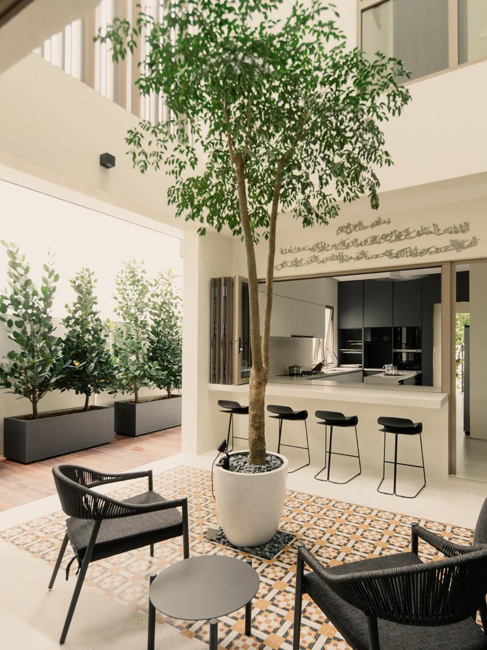 The courtyard on the first storey is a favourite spot of the owner's elderly mother-in-law. 