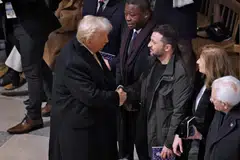 US President-elect Donald Trump greets Ukraine's President Volodymyr Zelensky inside Notre-Dame Cathedral ahead of a ceremony to mark the re-opening of the landmark cathedral. Together with French President Emmanuel Macron, they discussed ending the war in Ukraine.