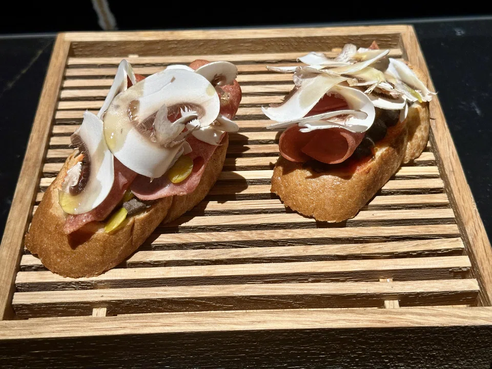 The Bismarck panini layers toasted baguette with mushroom duxelles, mortadella ham and raw mushroom shavings.