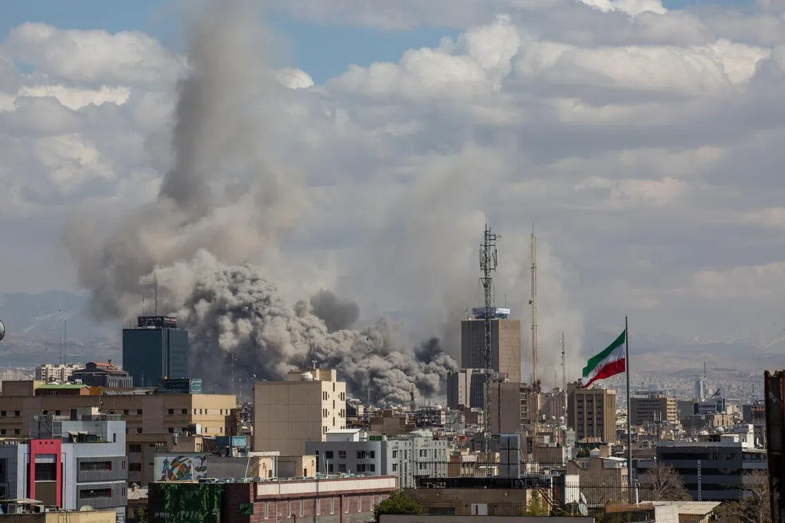 Smoke rises after coordinated US and Israeli airstrikes in Teheran, Iran, March 1, 2026.