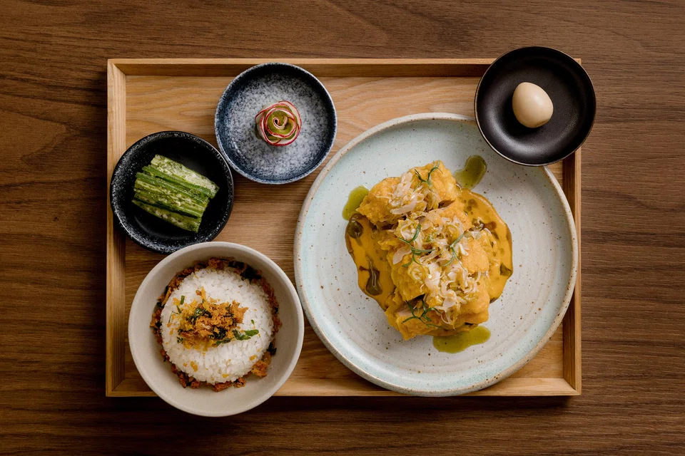 Fried chicken in yellow curry with coconut rice.