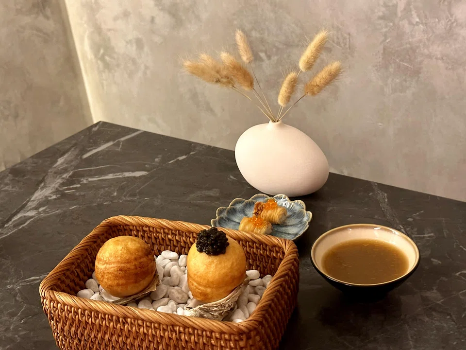 Fluffy brioche-like rolls are filled with oyster cream and a slippery mollusc.