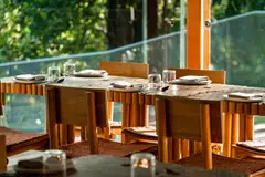 AIR's dining room is furnished with tables and chairs made of recycled wood.
