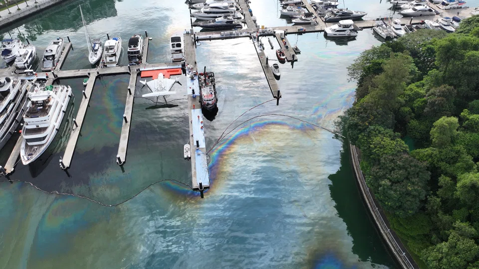 Containment booms were laid at the mouth of Keppel Marina last month to facilitate the clean-up efforts of the accumulated oil.