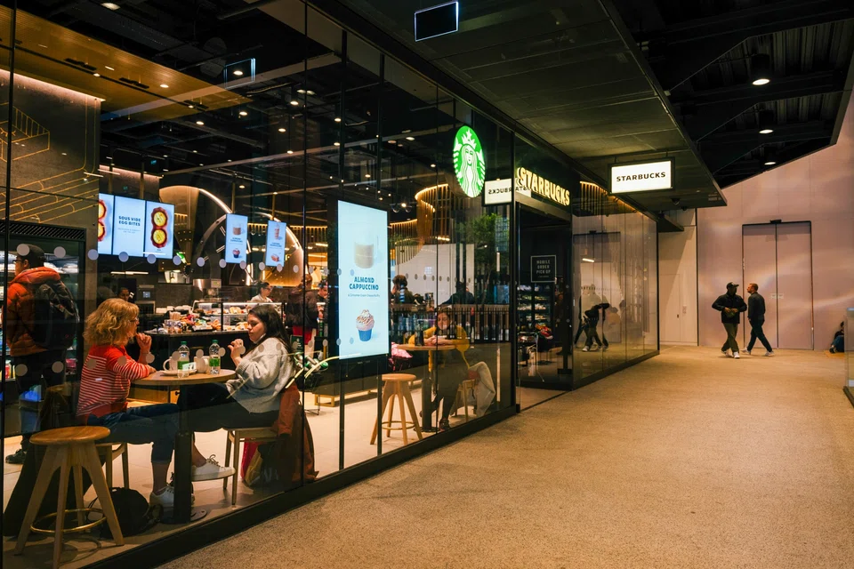 Starbucks is testing new store designs in the US as it looks to reverse a sales slump.