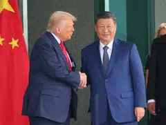 US President Donald Trump (left) said his meeting with Chinese President Xi Jinping was a “great success” and that he would head to China in April for new talks.