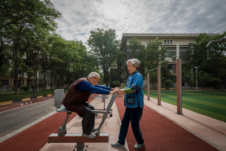Elderly residents exercising at the Perennial Alzheimer’s Care Village; the development is premised on a novel idea that Alzheimer’s patients should be able to move freely.