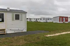 Manufactured housing has become an increasingly popular hybrid between rental and ownership as it allows residents to lease land but own their pre-fabricated house. 