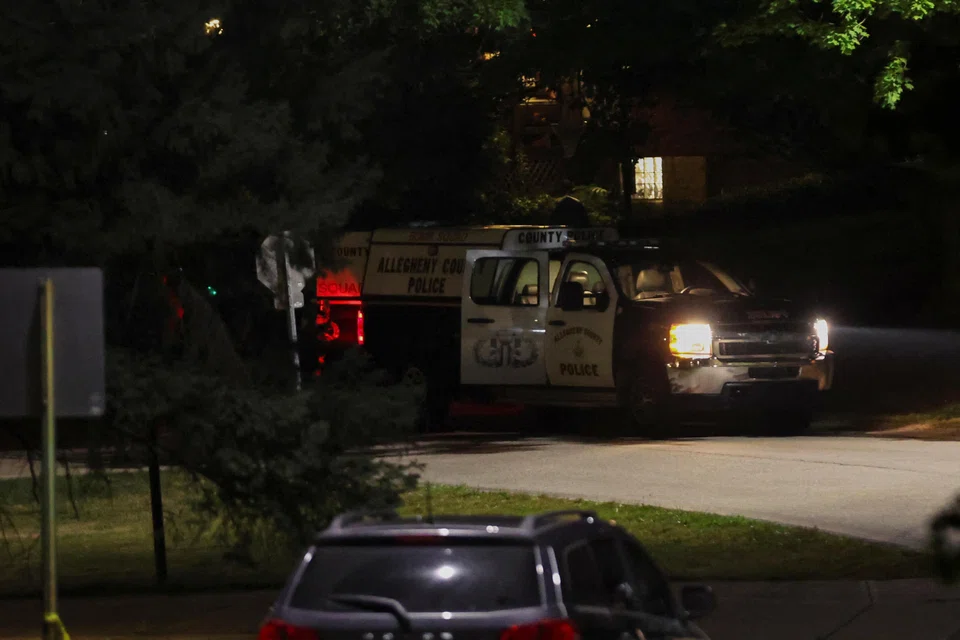 Police from the Allegheny County Police Department guarding the perimeter of the home of the suspected shooter, 20-year-old Thomas Matthew Crooks.