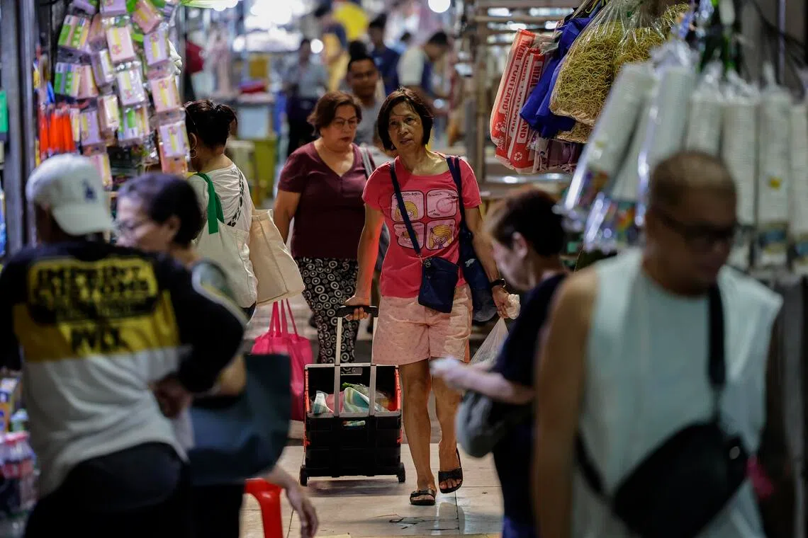 epa12933530 A person pulls a cart of items purchased at a market in Marikina City, Metro Manila, Philippines, 05 May 2026. According to data released on 05 May by the Philippine Statistics Authority (PSA), overall inflation in the Philippines increased to 7.2 percent in April 2026 from 4.1 percent in March 2026. Among the factors of increased inflation were costs of food, household utilities, transport and fuel.  EPA/ROLEX DELA PENA