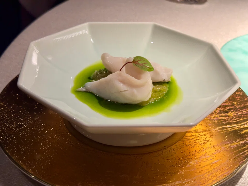 Steamed croaker in a ginger-scallion sauce.