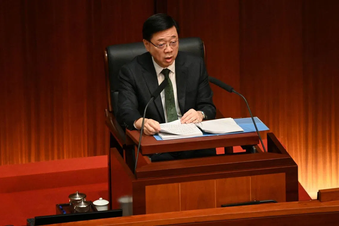 Hong Kong Chief Executive John Lee delivers his annual policy address in the Legislative Council chamber in Hong Kong, Oct 16, 2024.