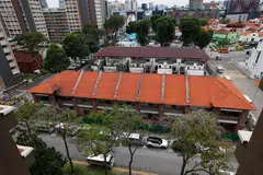 The site, spanning about 0.34 hectare, features 18 two-storey terraced houses built in 1927. 