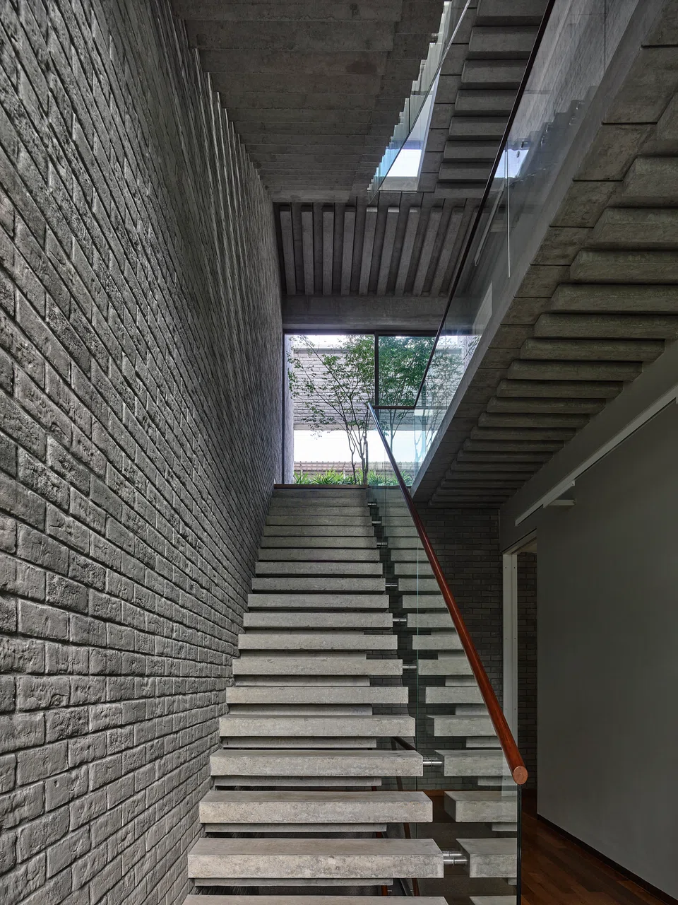 Concrete and brick define the stair core.