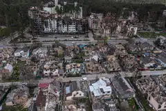 FILE -- Residential buildings destroyed after weeks of fighting in Irpin, Ukraine, May 2, 2022. As President Vladimir Putin of Russia wages war in Ukraine, the United States and its allies have imposed a range of sanctions that have battered the Russian economy. (David Guttenfelder/The New York Times)
