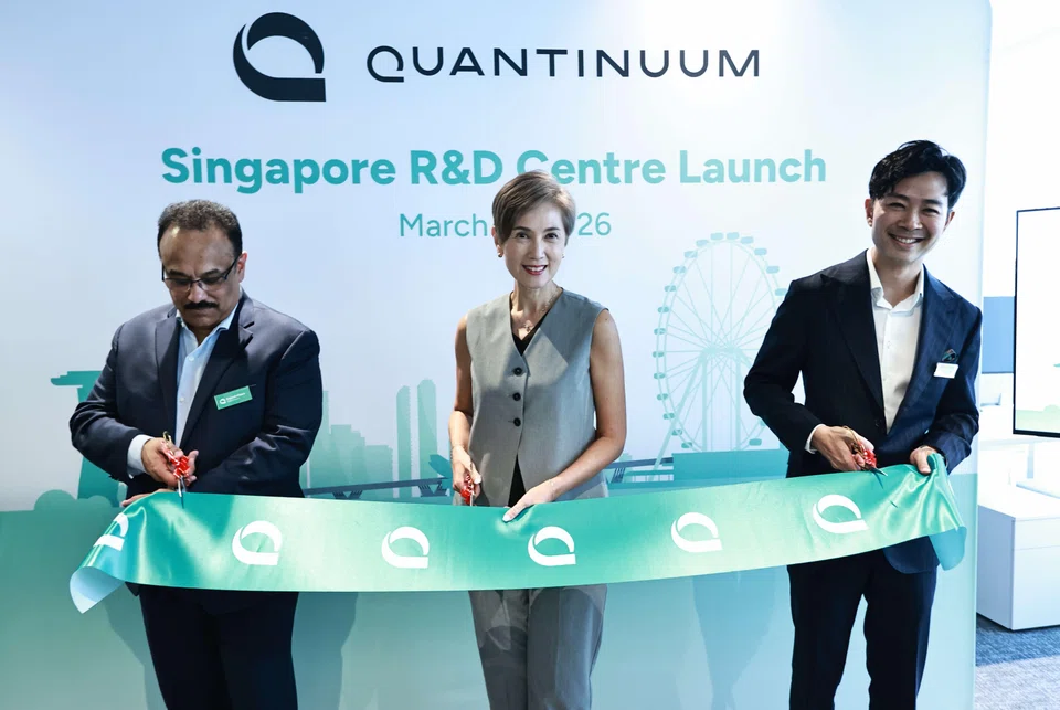 Minister Josephine Teo with Quantinuum’s Dr Rajeeb Hazra (left) and Dr Marvin Lee at the opening ceremony of the company's facility on Wednesday.