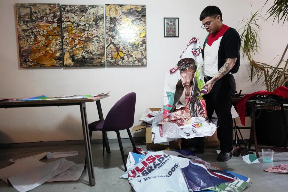 For the last year, Morales has been pulling down the ubiquitous banners, taking scissors to them and sewing them into tote bags, which he sells for between 100 pesos (S$7.35) and 600 pesos.