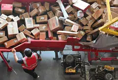 A worker sorts packages at JD's warehouse during Singles' Day, China's massive annual shopping event in Beijing, China, Nov 11, 2025.