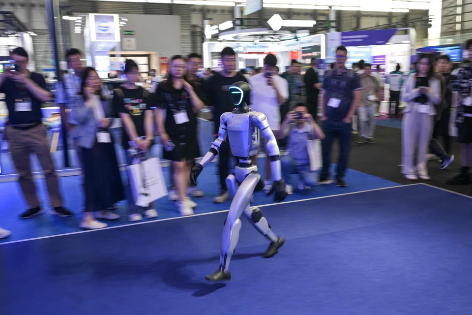 A robot controlled by a remote by Unitree Robotics walks during the Mobile World Congress (MWC 2026) at the Shanghai New International Expo Centre in Shanghai on Jun 18.